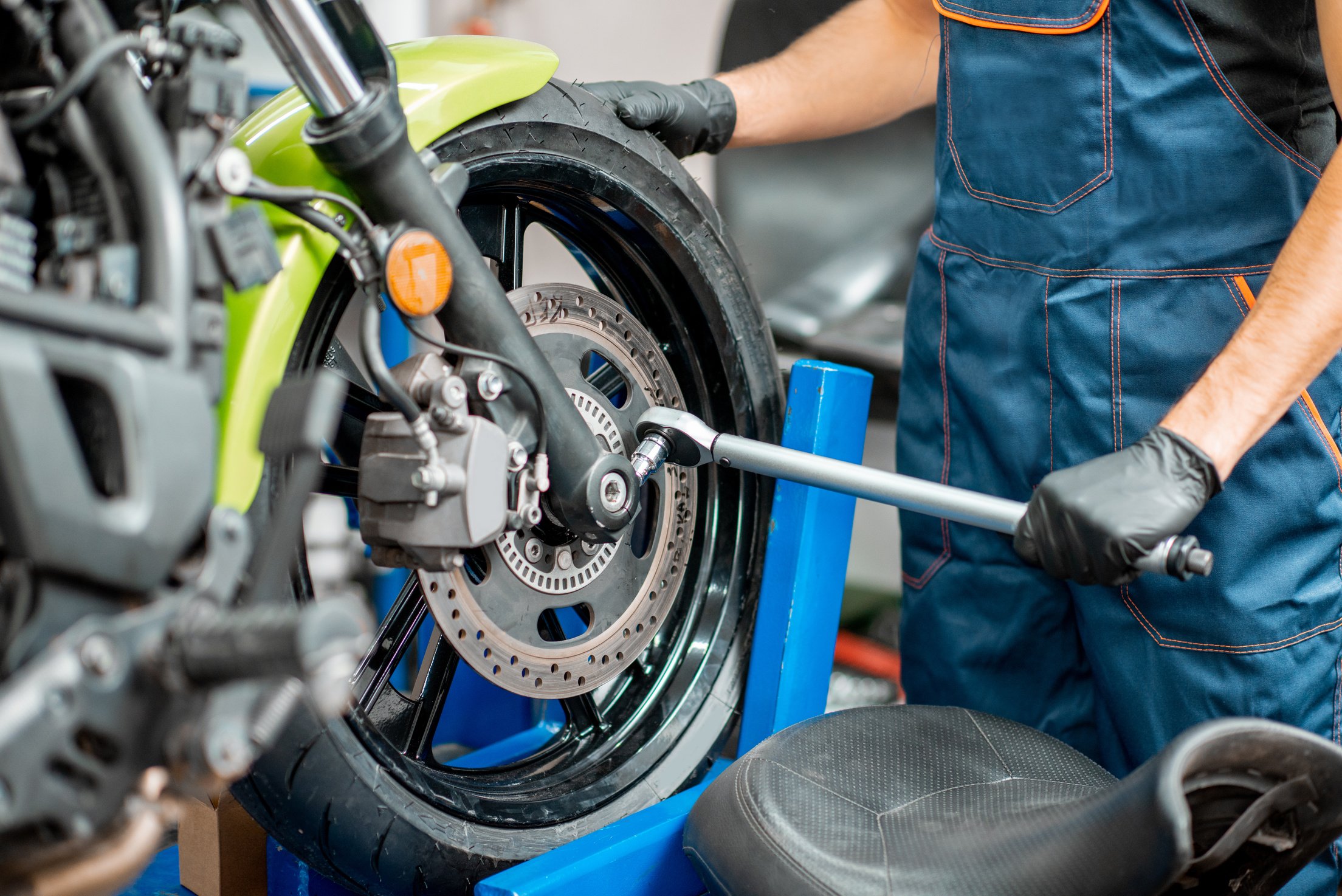 Repairing Motorcycle at the Workshop